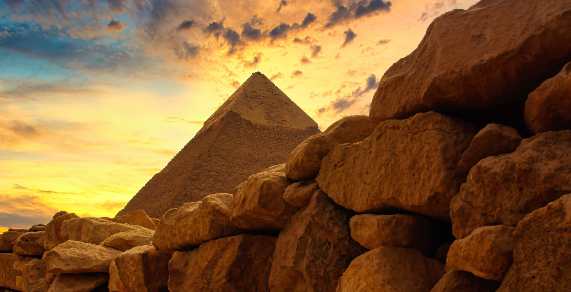 The famous Chephren pyramid behind a historic stone wall at Giza in Egypt 1905x976 crop 48 37