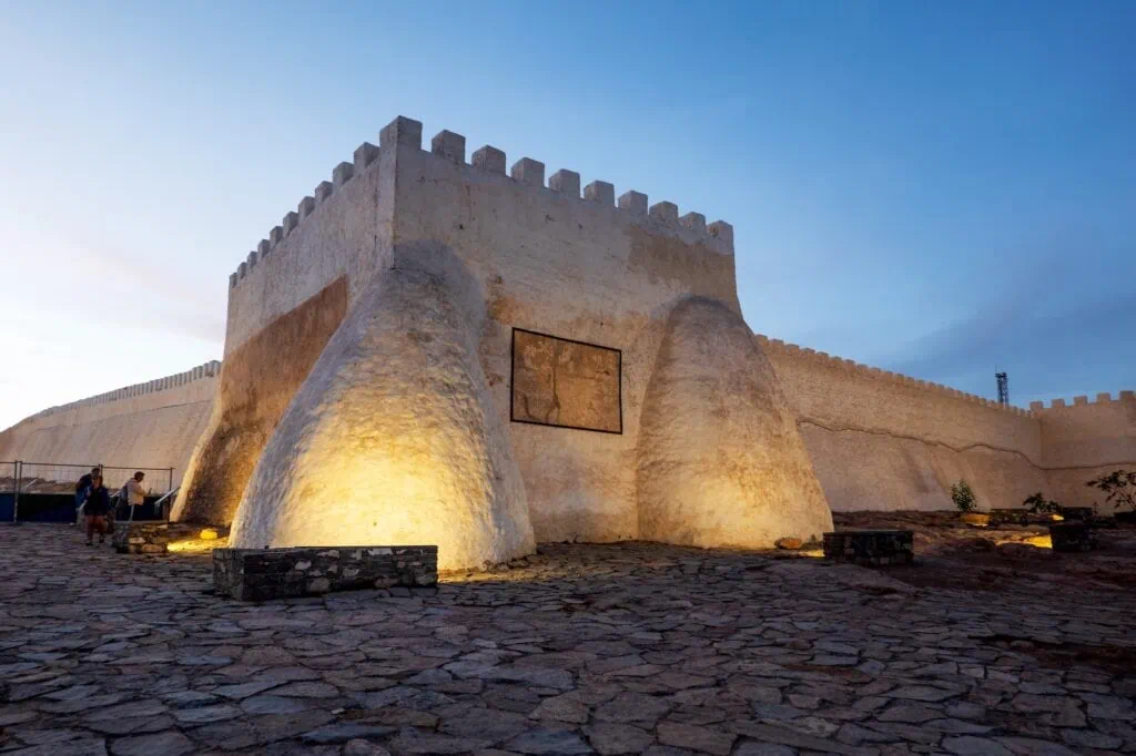 Stone fortress walls and ruins overlooking the coastline and urban area at Kasbah of Agadir Oufla, Agadir