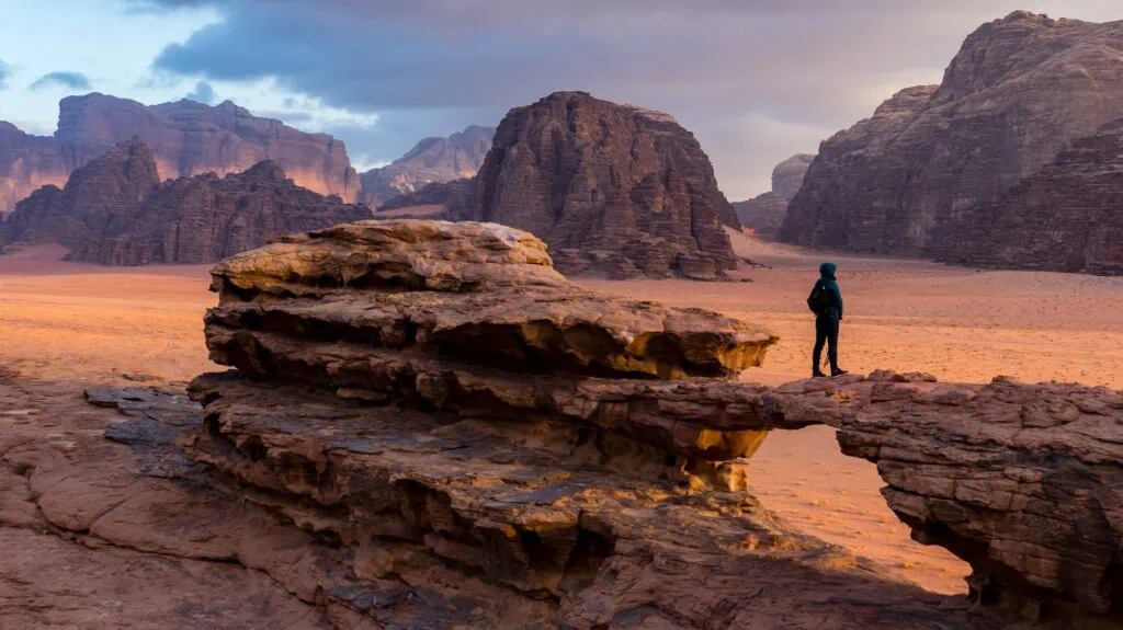 View across the red sandstone valleys, mesas, and rock formations of Wadi Rum protected area in southern Jordan — UNESCO-listed desert landscape used as filming location for Lawrence of Arabia, The Martian, and Dune