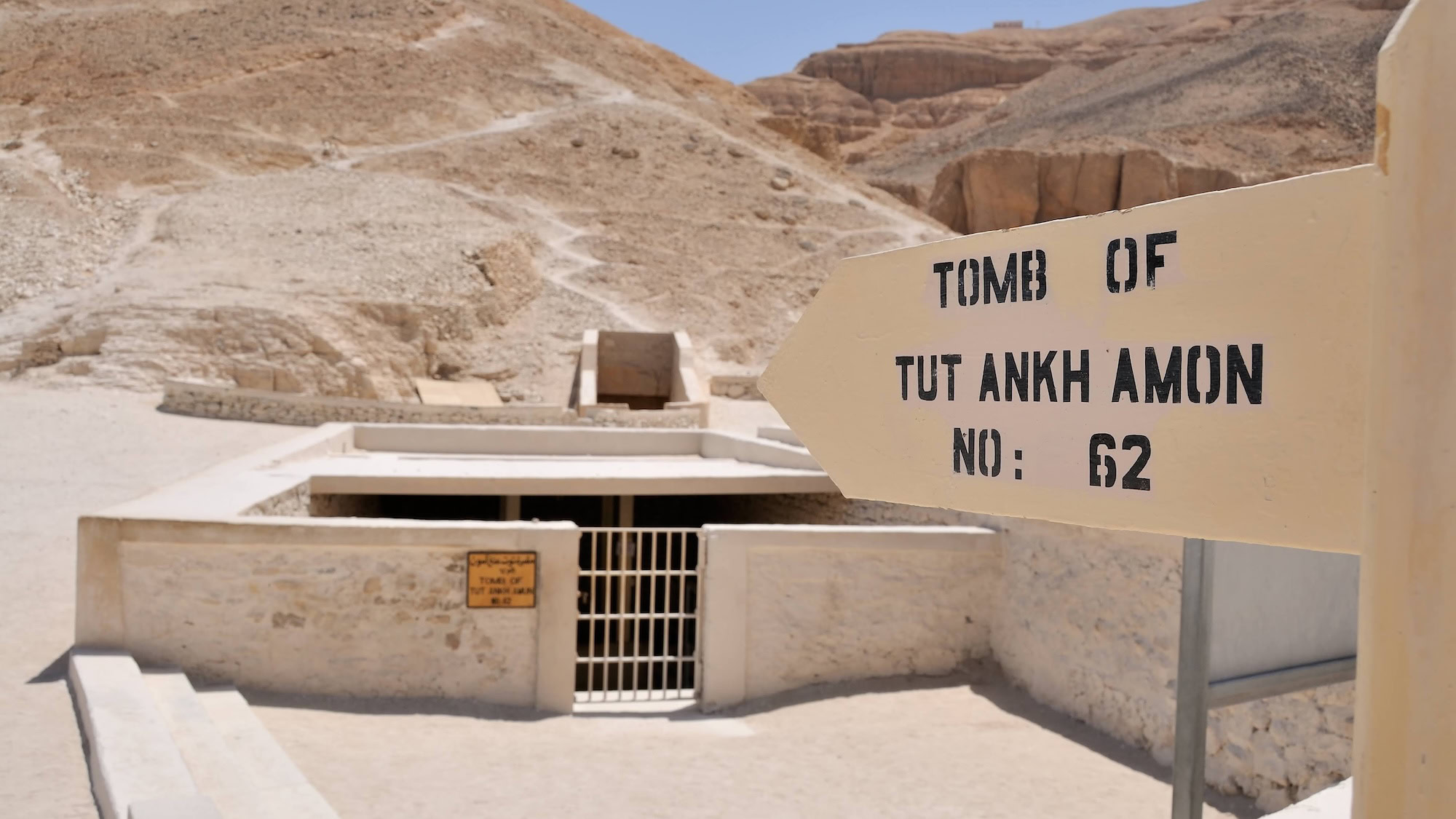 Entrance to King Tutankhamun's tomb in the Valley of the Kings with protective structure and signage