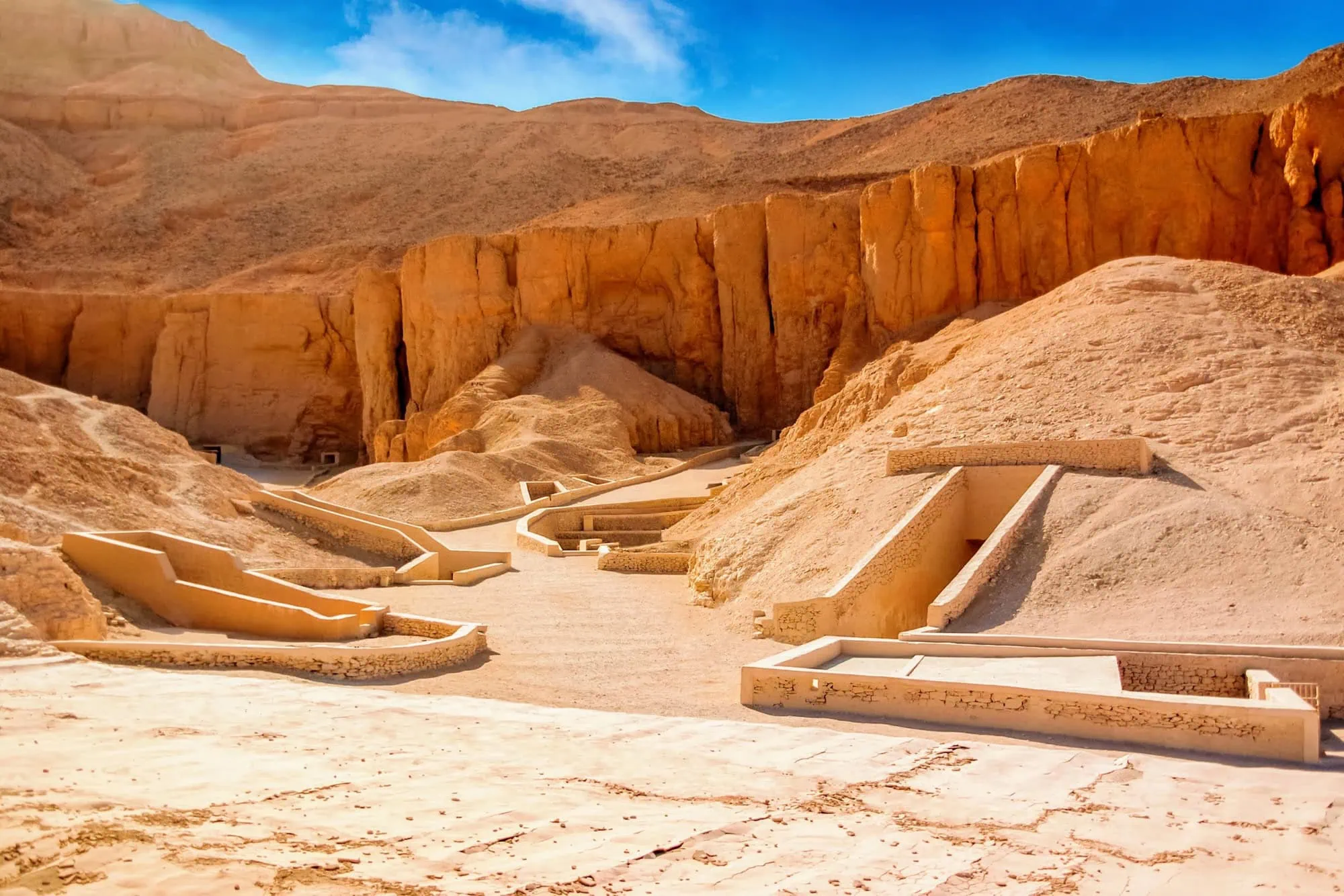 Ancient tomb structures and stone foundations in the Valley of the Kings, Egypt
