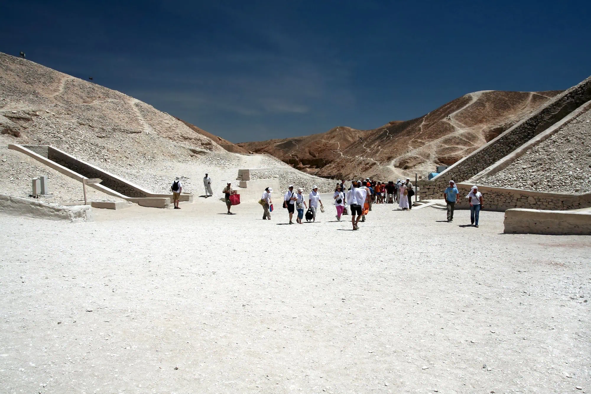 Valley of the Kings entrance with stone pathways and desert hills where pharaohs were entombed
