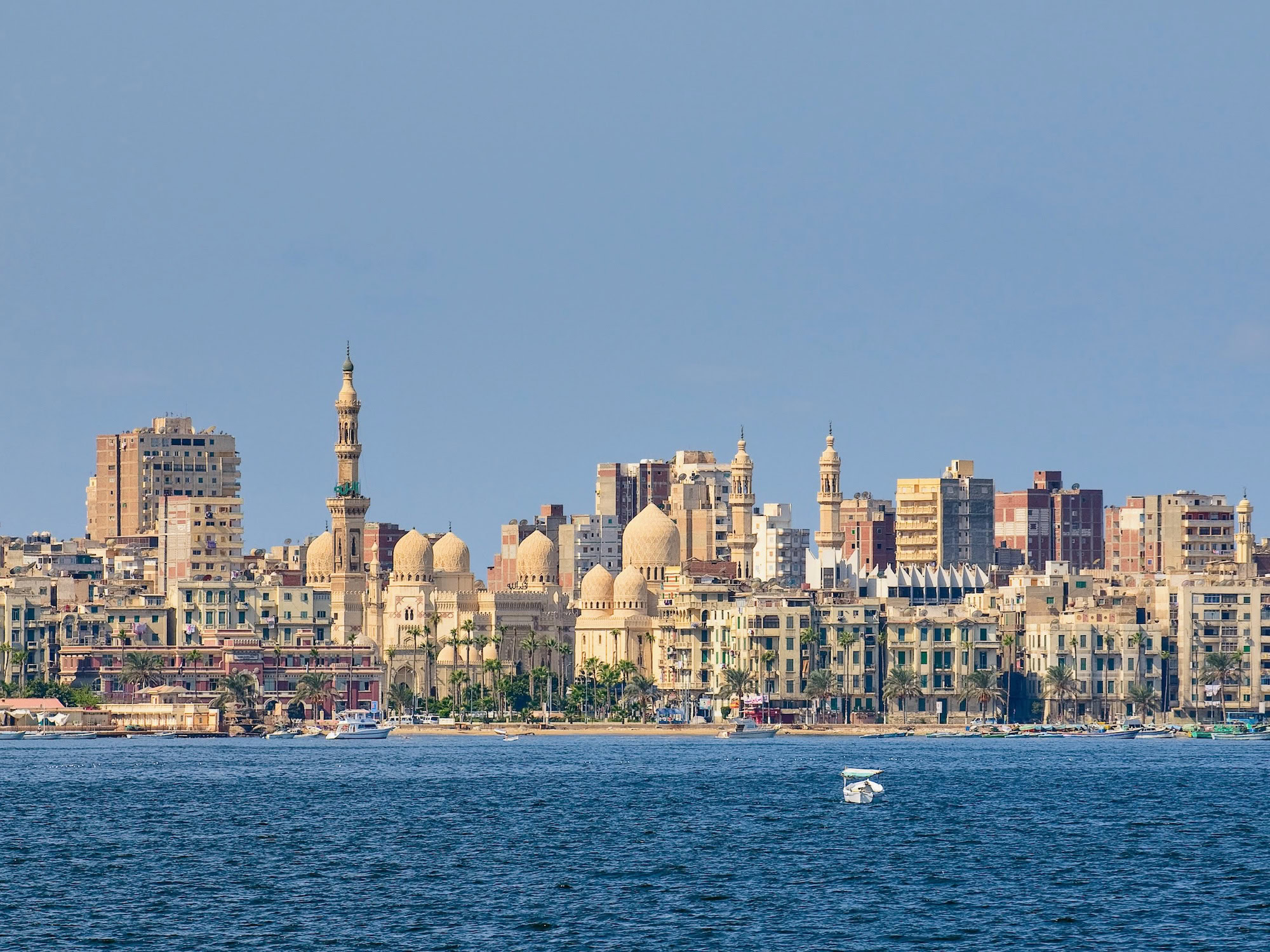 Alexandria waterfront showing historic mosques, minarets and buildings along the water