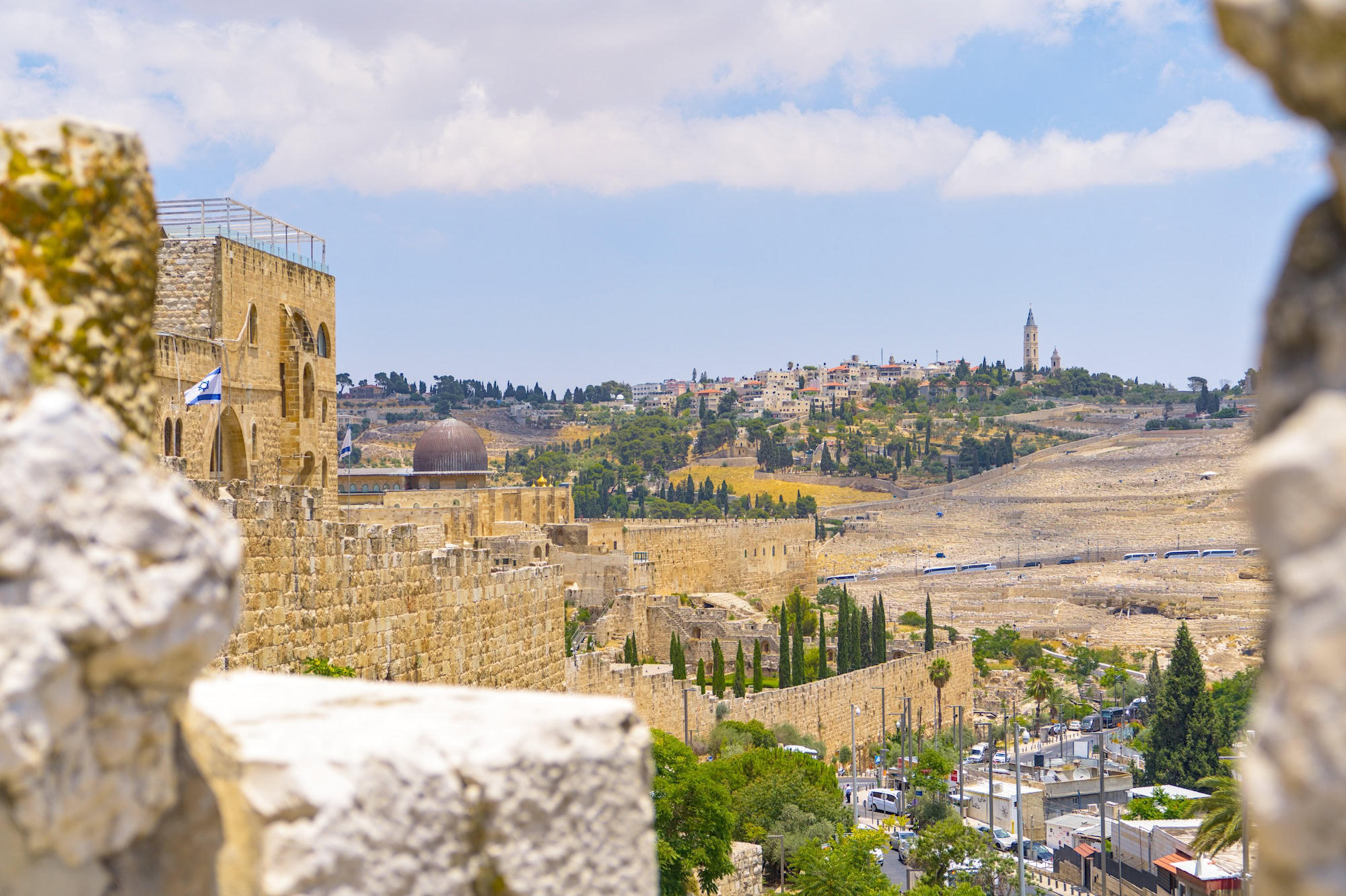 View of Jerusalem's Old City with the Dome of the Rock and Israeli flag