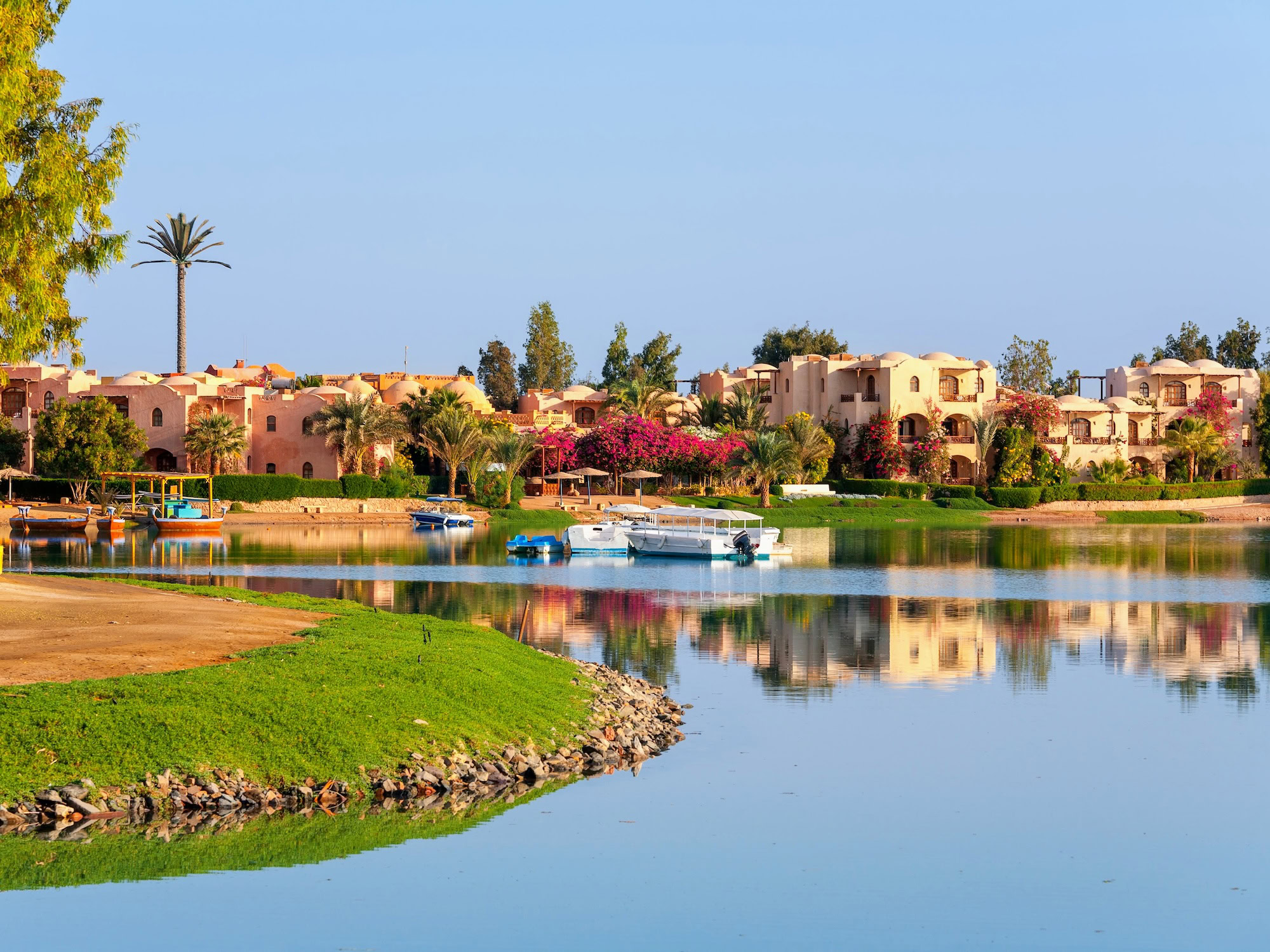 Boats and resort buildings along a peaceful lagoon at El Gouna Red Sea resort