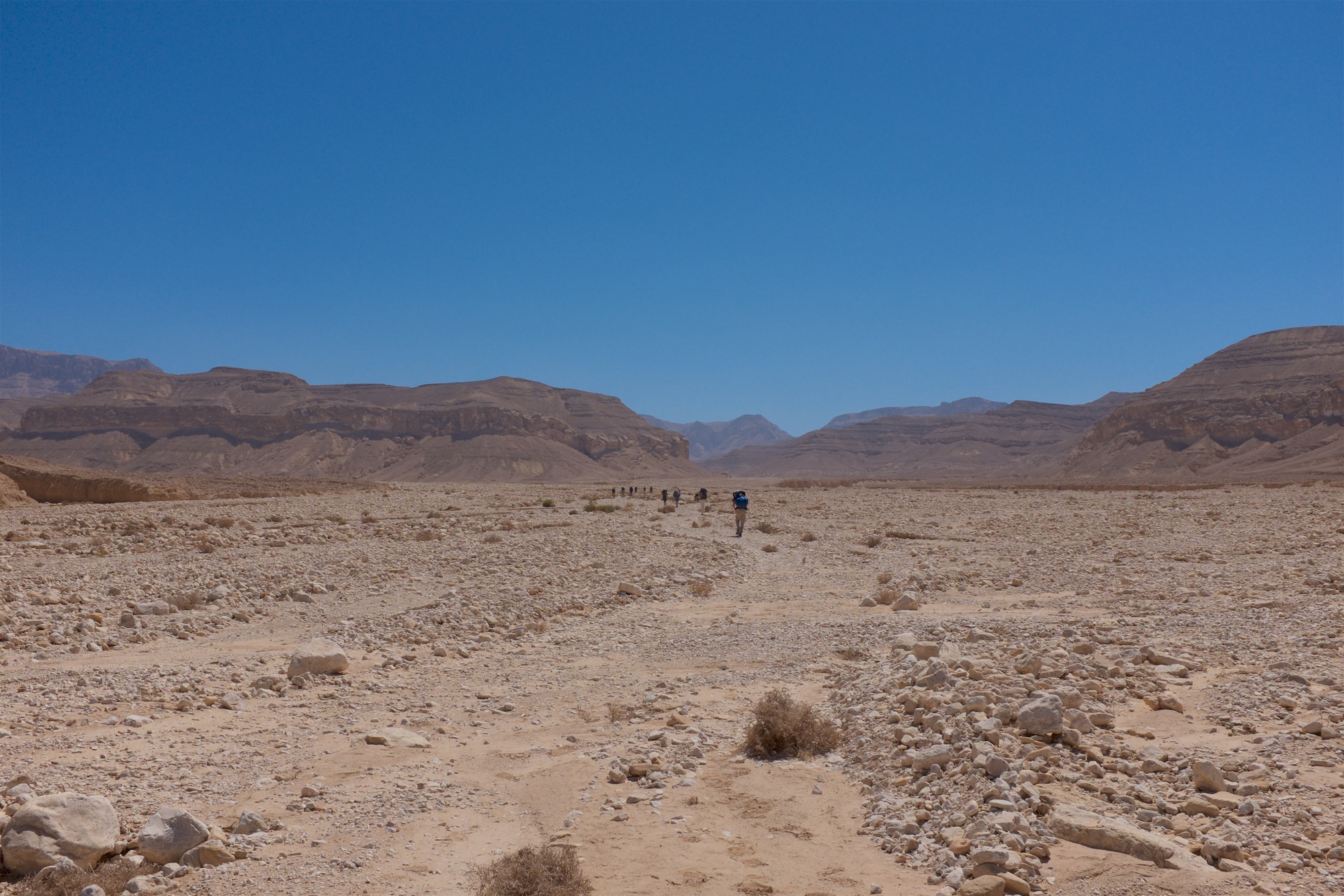 Pilgrims walking through desert landscape between Saint Anthony and Saint Paul Monasteries in Egypt