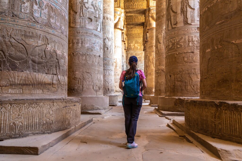 Woman tourist at Dendera temple in a sunny day Luxor Egypt