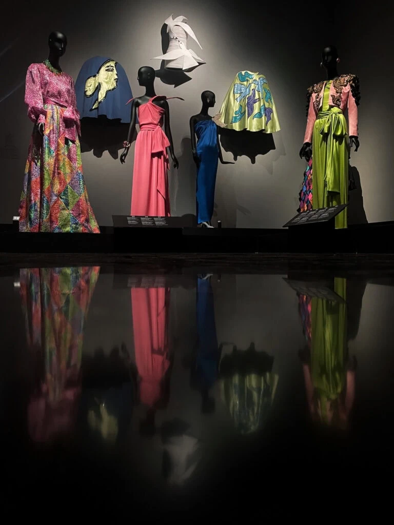 Yves Saint Laurent Museum display of mannequins wearing colorful haute couture garments and headpieces Marrakech