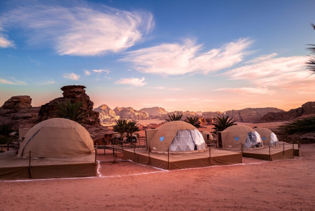 camping tents sit in the wadi rum desert of Jordan