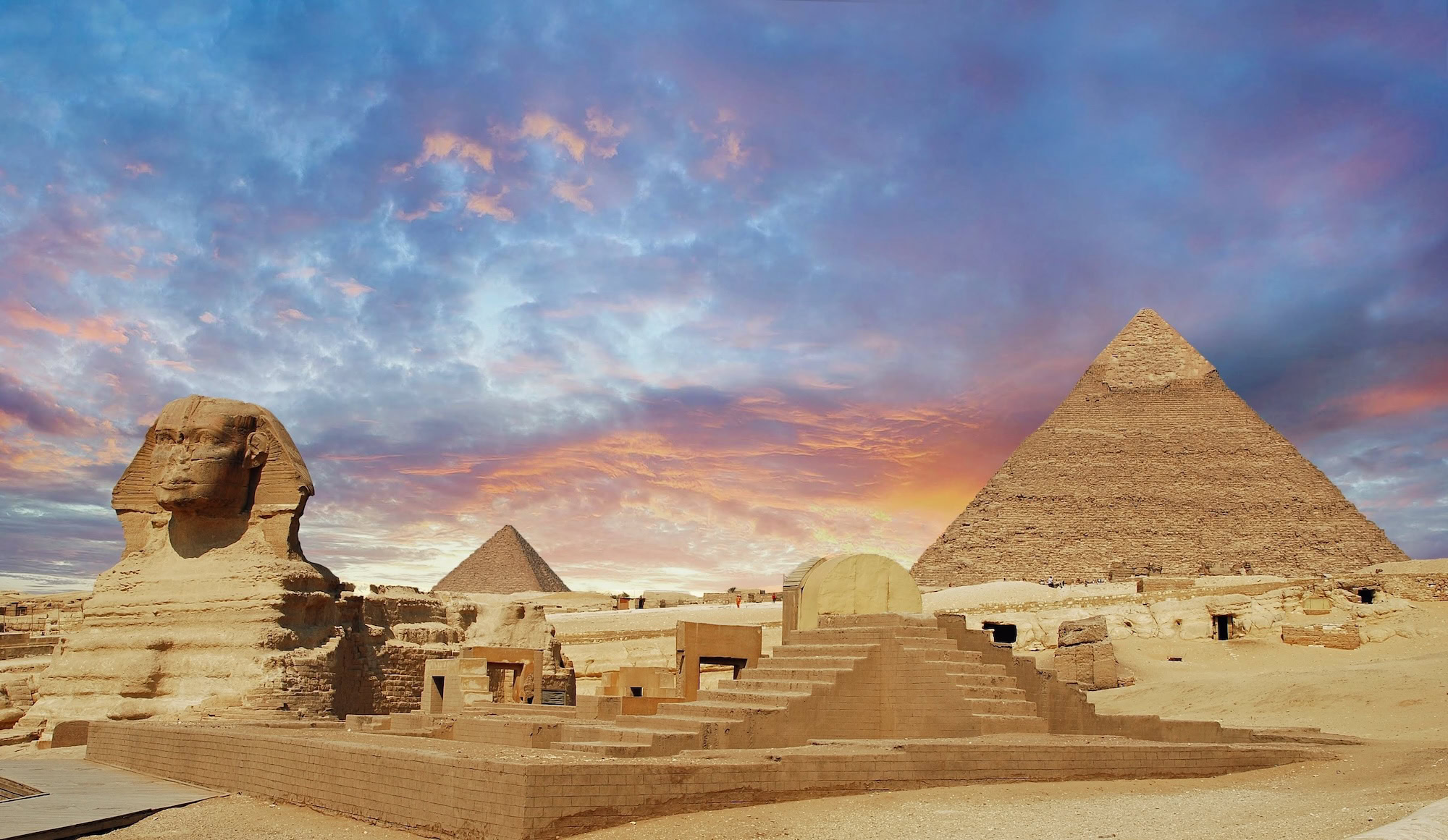 Great Sphinx and pyramid showing detailed ancient stone construction blocks at Giza