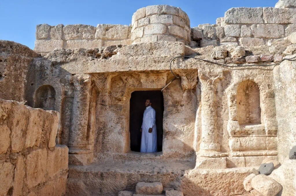 Entrance pathway and stone facade of Ashabe-Kahf Cave near Amman