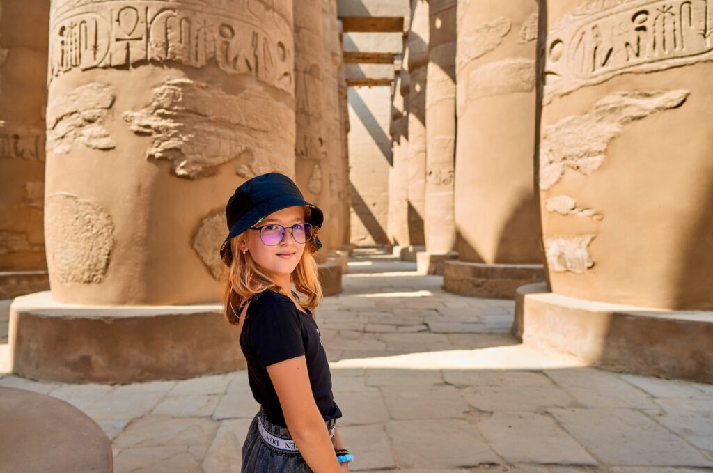 girl among the columns of karnak temple