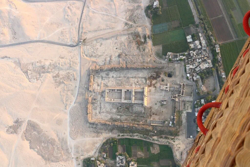 Aerial view of the Medinet Habu temple complex and surrounding desert landscape seen from a hot air balloon, Luxor