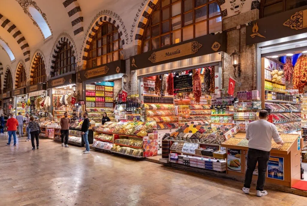 Shops displaying spices, sweets, textiles, and souvenirs