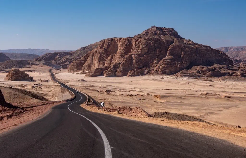 Road stretching between rocky mountains in the Sinai Desert