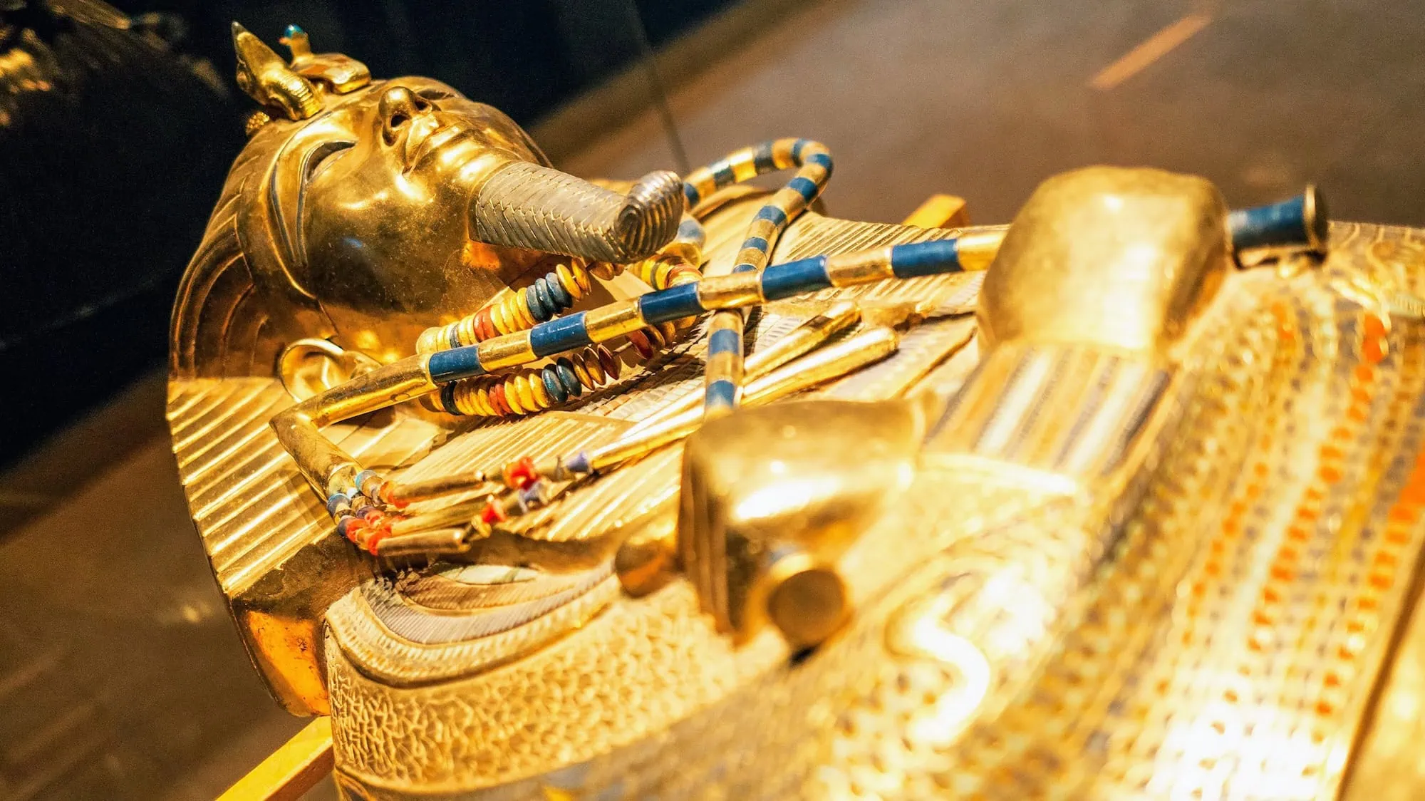 King Tutankhamun's golden sarcophagus with pharaoh mask displayed in museum