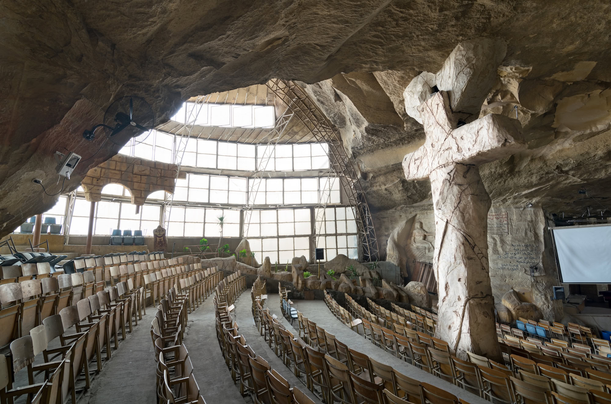 Interior of Cave Church of Saint Simon the Tanner showing carved stone walls and religious elements