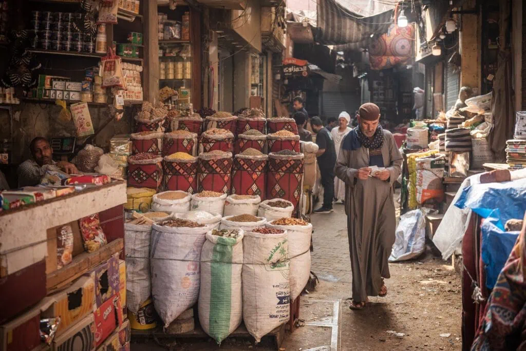 Spice Market stalls displaying spices and goods near Khan El Khalili Bazaar, Al Hussein, Cairo