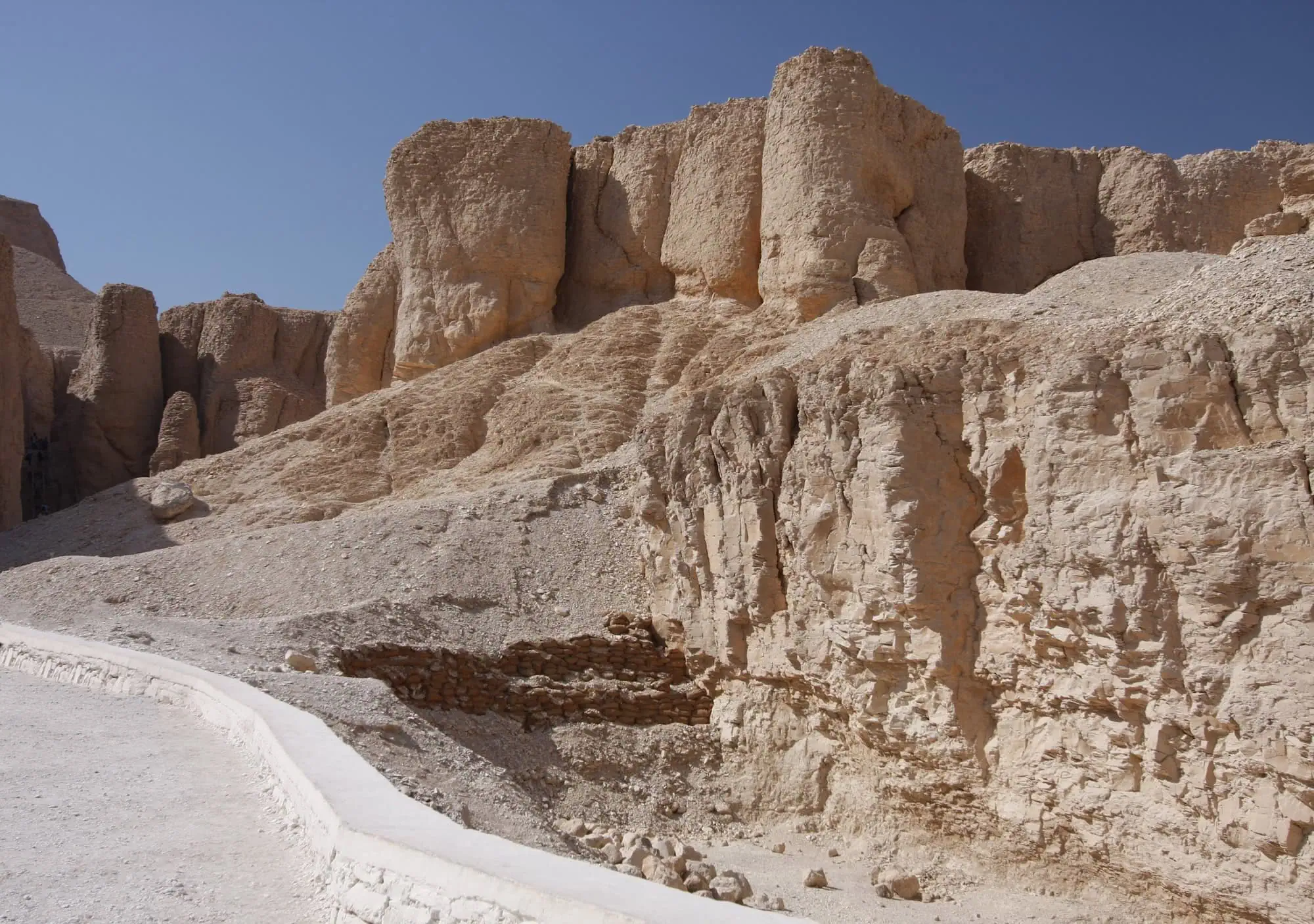 Valley of the Kings limestone cliffs and ancient burial grounds in desert landscape