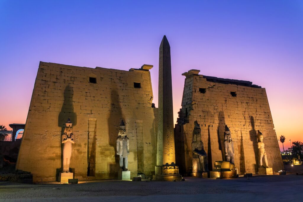 Luxor temple and its obelisk illuminated at night