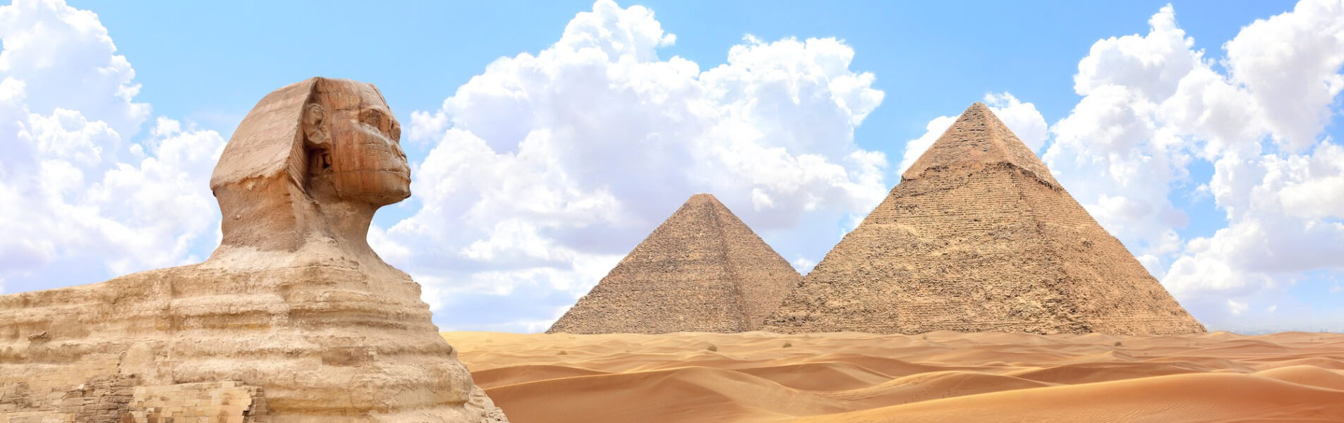 Famous Great Sphinx and pyramids of Chephren and Cheops, Cairo, Egypt. Great Pyramids and ancient statue of Sphinx,