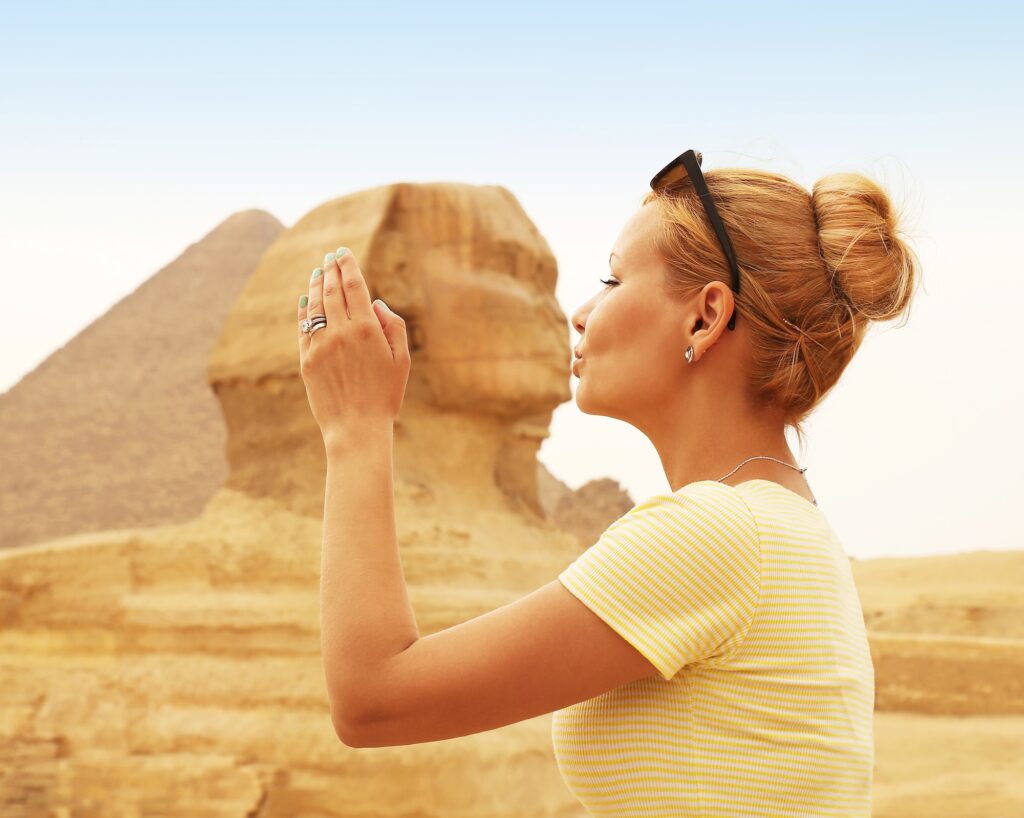 Tourist kissing the Sphinx, Cairo