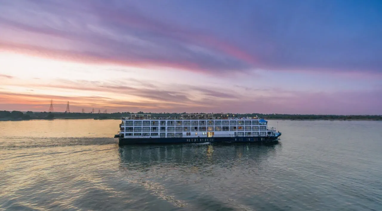 Cruise ship glides along the tranquil Nile River