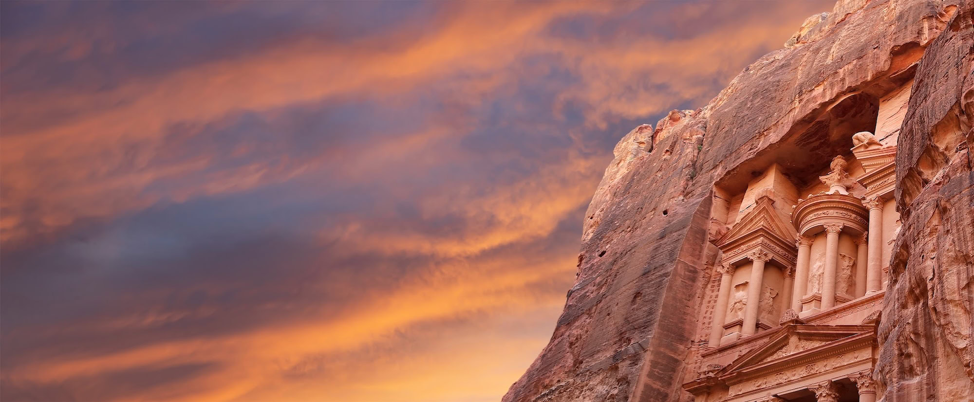 Al Khazneh or The Treasury (against the background of a beautiful sky with clouds). Petra, Jordan-- it is a symbol of Jordan, as well as Jordan's most-visited tourist attraction-1