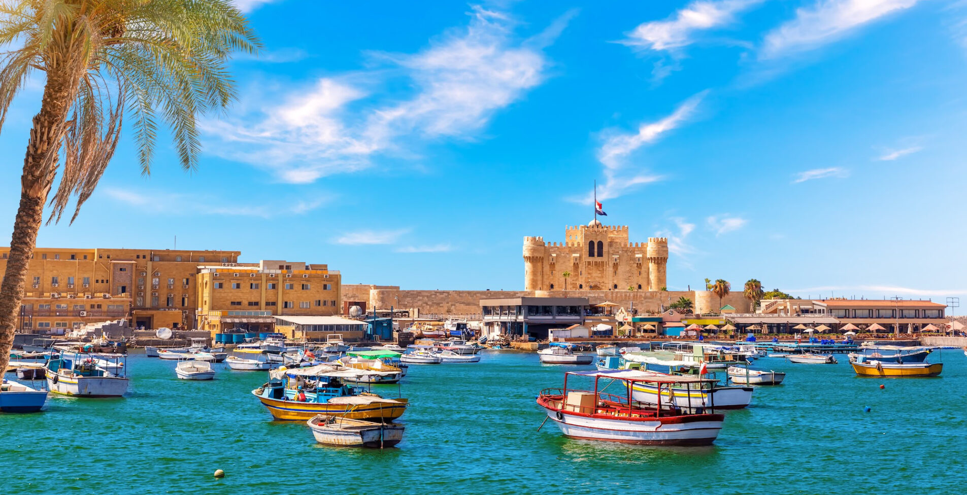 Alexandria harbour boats near Qaitbay fort point of the famous lighthouse Egypt