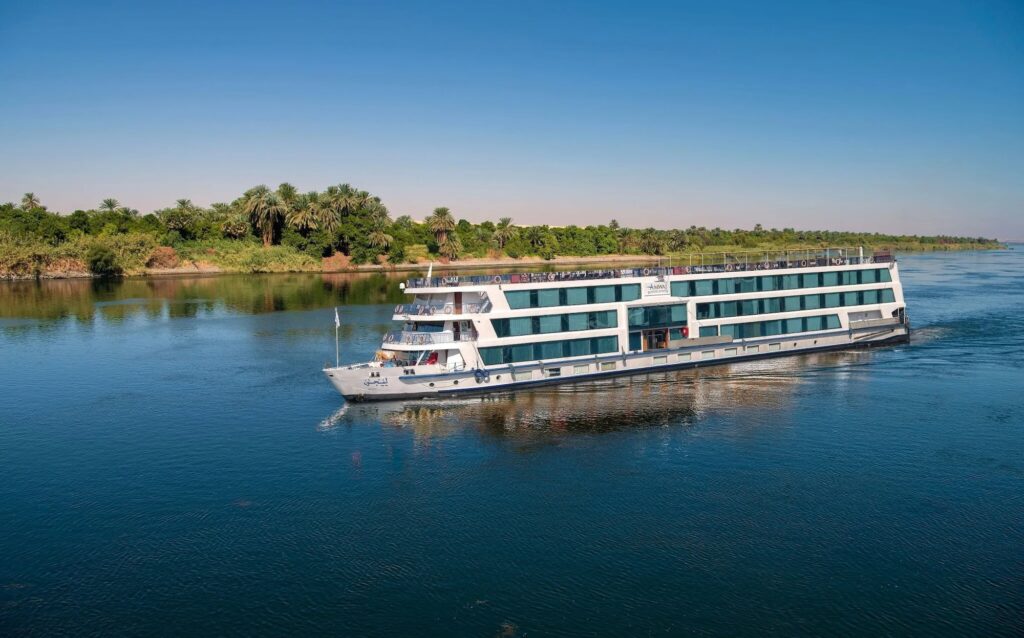 Large classic cruise ship sailing along the Nile River