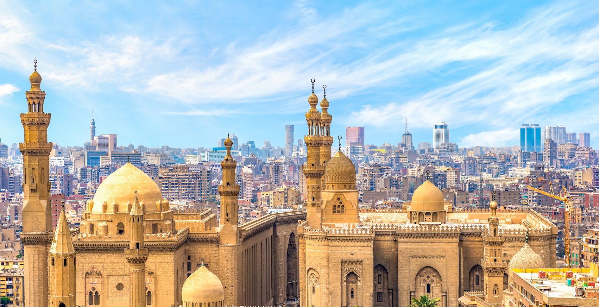 Clouds over majestic ancient Sultan Hassan Mosque in Cairo Egypt 1905x976 crop 51 71