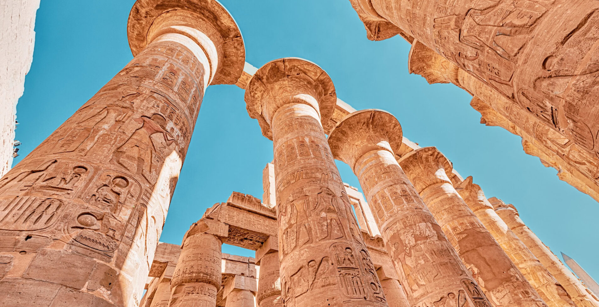 Hypostyle Hall with huge columns in Karnak temple in the famous city of Luxor 1905x976 crop 48 35
