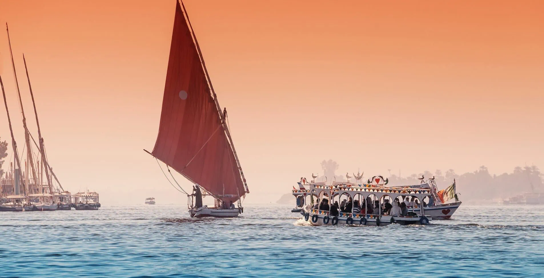 Luxor felucca is a traditional sailing boat used for tourist transport and cruise down the Nile 1905x976 crop 54 58