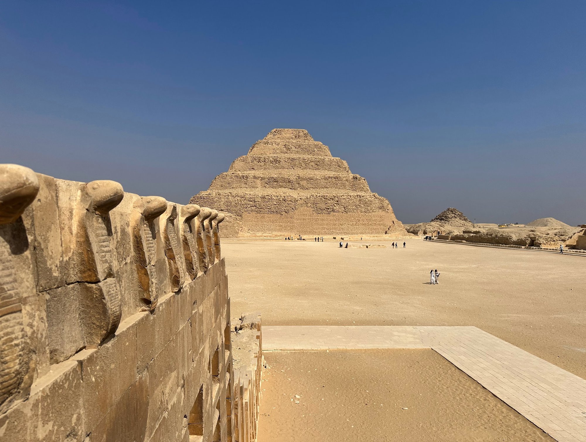 Step Pyramid of Djoser at Saqqara with tourists and wooden walkway