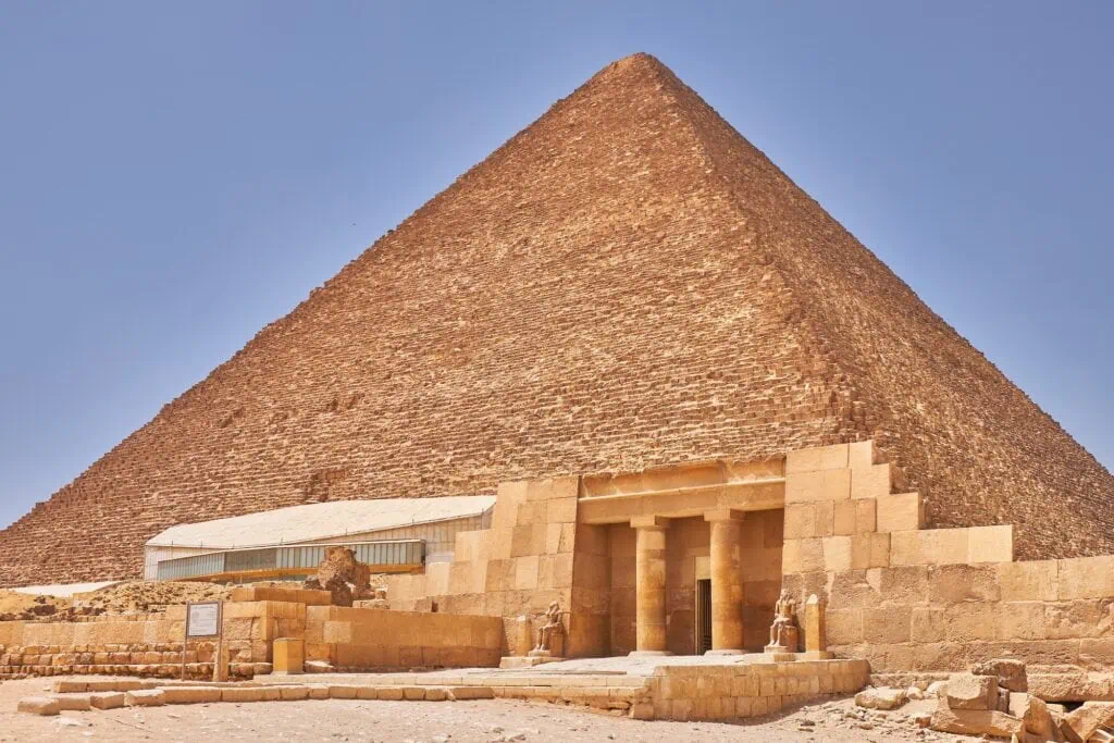 The Great Pyramid of Khufu rising above the desert plateau at Giza in golden afternoon light - The Most Famous Pyramids in Egypt