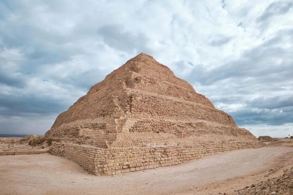 The six-stepped Pyramid of Djoser rising above the desert plateau at Saqqara, south of Cairo