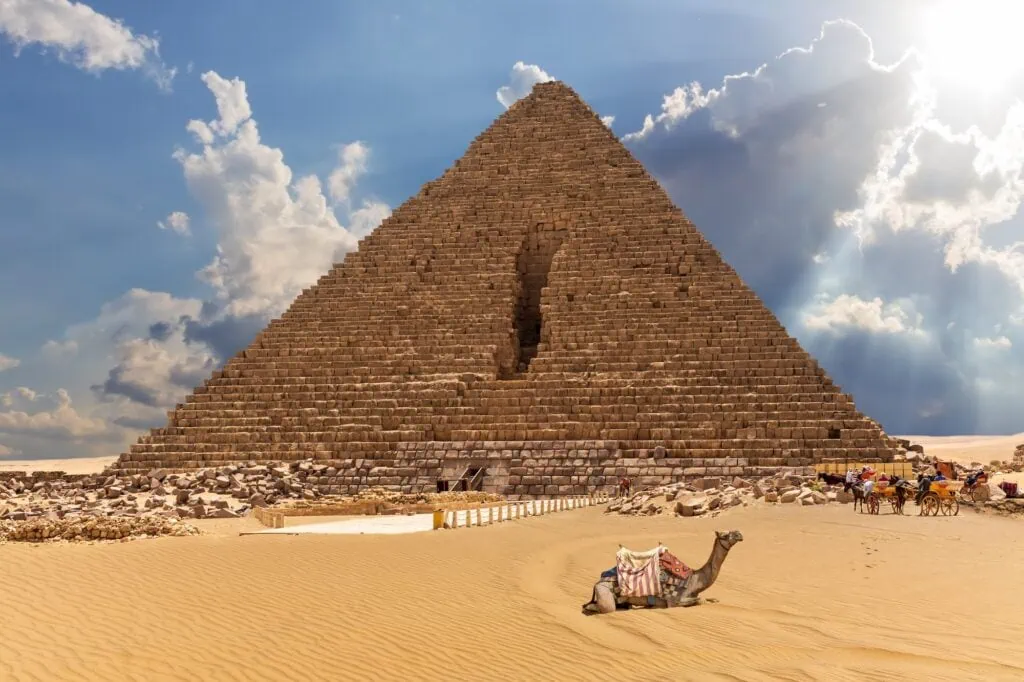 The Pyramid of Menkaure with camels and horses nearby