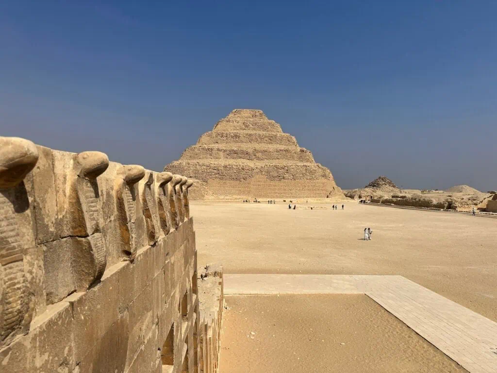 The six-stepped pyramid of Pharaoh Djoser rising above the desert plateau at Saqqara, south of Cairo