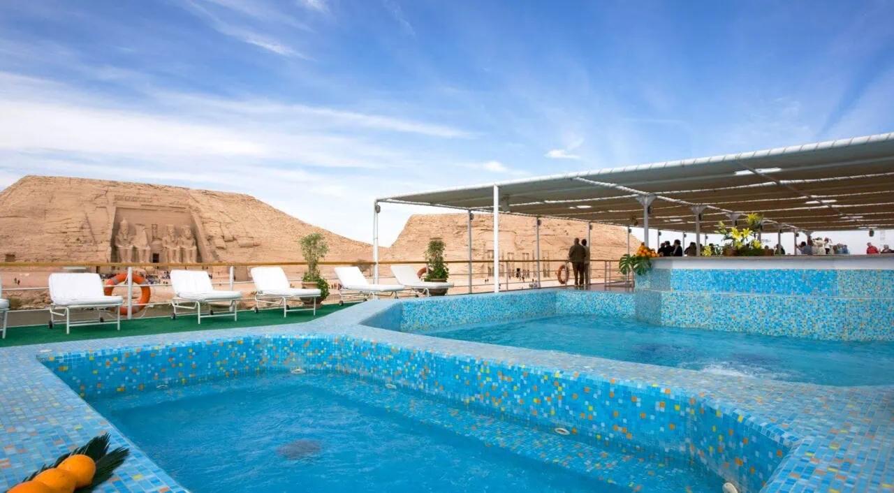 Outdoor pool on Mövenpick Prince Abbas with Abu Simbel view