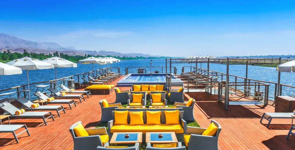 Swimming pool and sun deck aboard the Oberoi Philae, an all-suite flagship-tier 5-star Luxury Nile Cruise vessel sailing the Luxor–Aswan stretch, with one of the larger heated pools in the Nile cruise fleet.