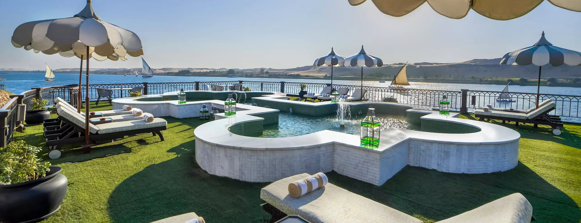 Sun deck with pool and loungers on Mövenpick SS Misr
