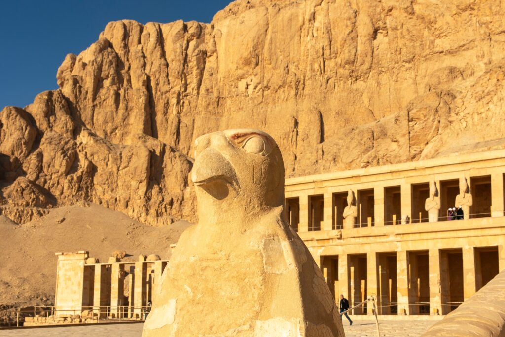 The statue of Horus, the falcon-headed god, stands guard over the ancient Temple of Hatshepsut at Luxor