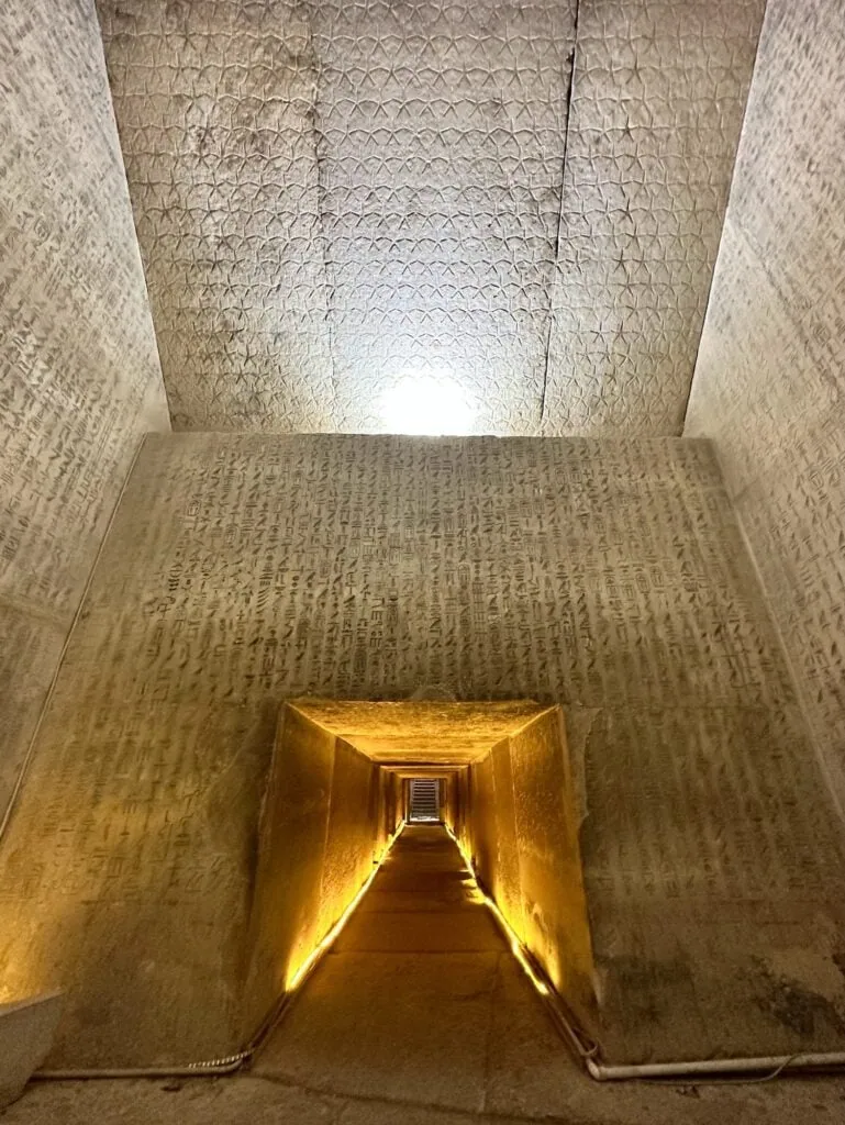Stone corridor with walls densely carved in hieroglyphic inscriptions inside the burial complex, Unas Pyramid, Saqqara