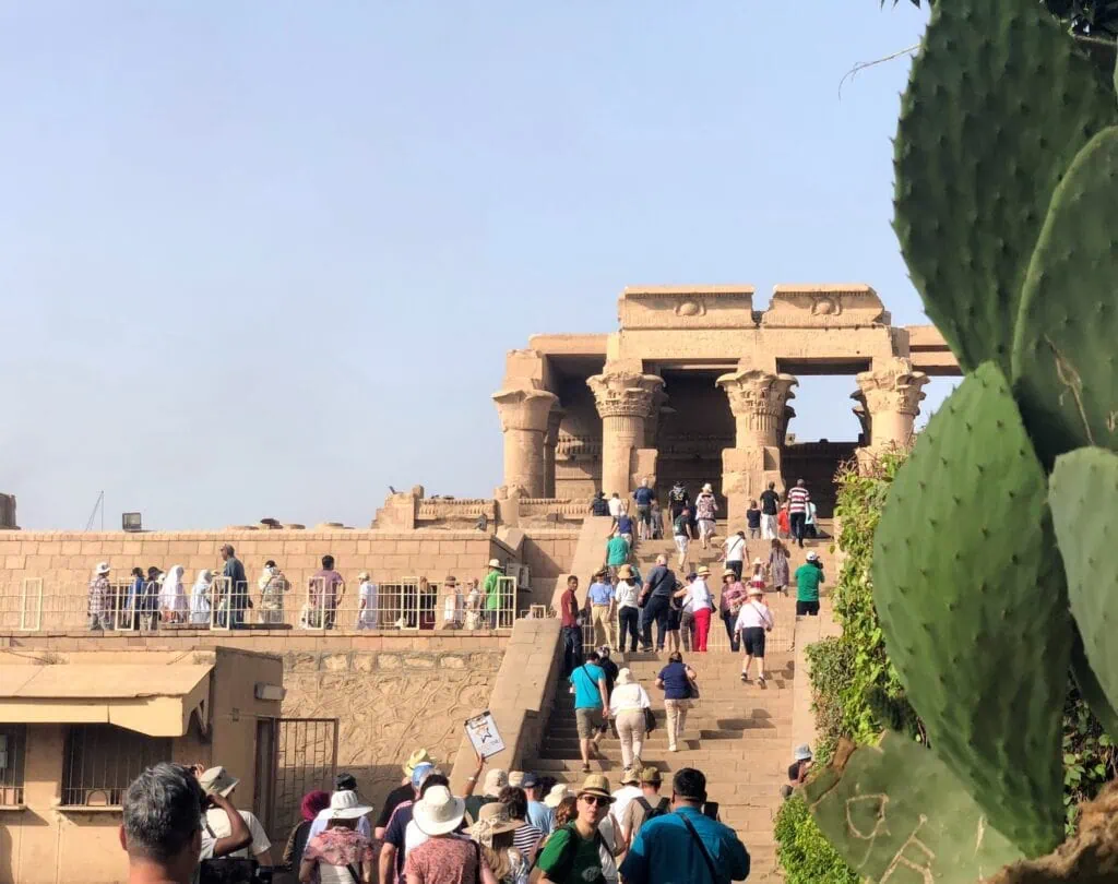 Tourist walking toward the entrance of Kom Ombo Temple, Kom Ombo Temple approach, Kom Ombo