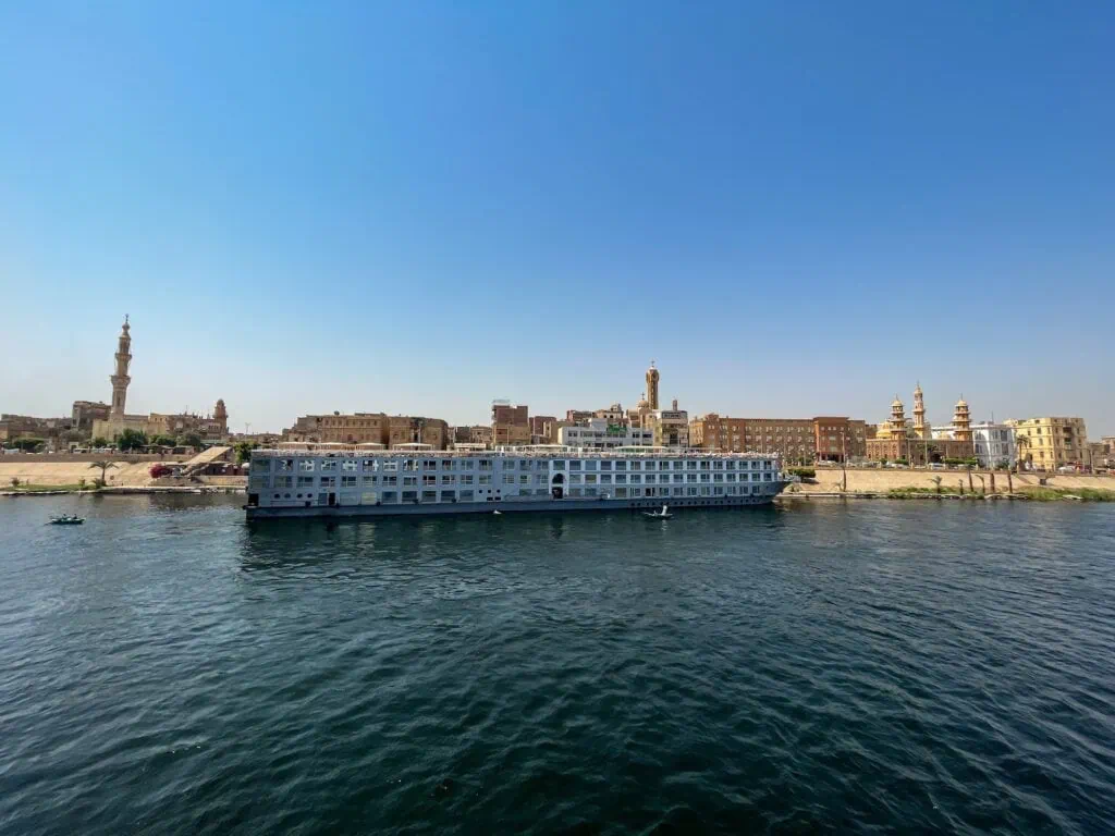 A cruise ship anchored along the Nile River