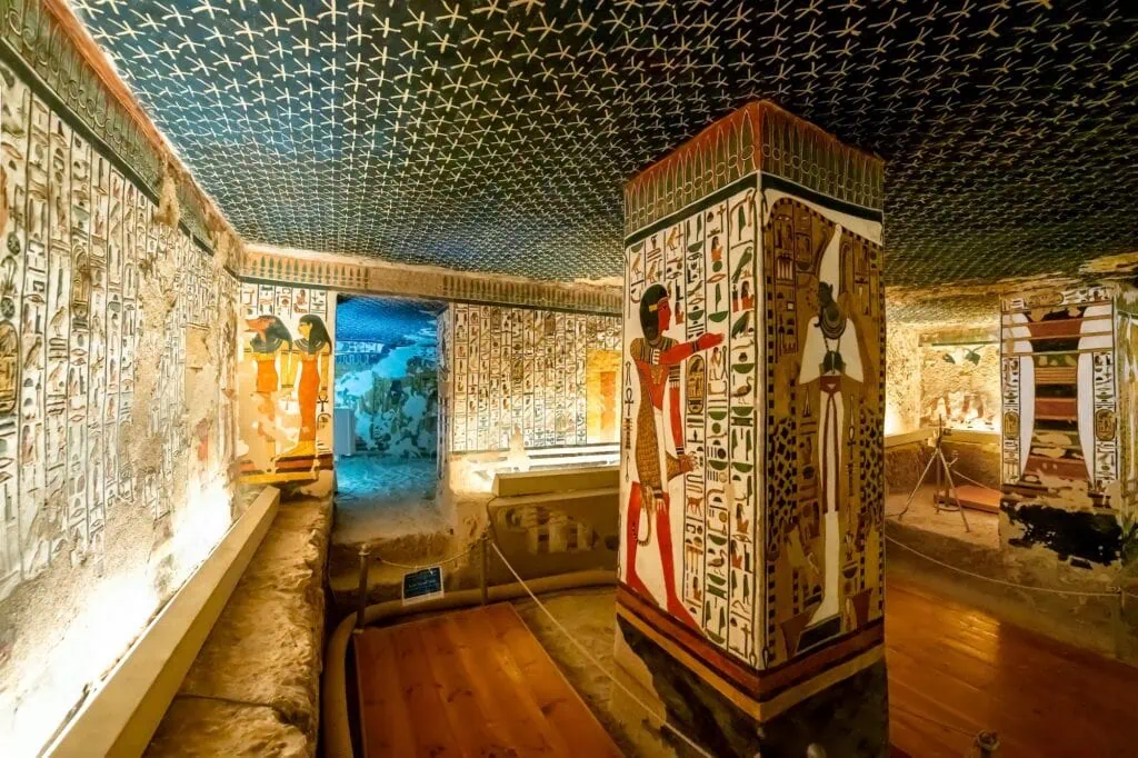 The upper pillared hall inside the Tomb of Seti I (KV17) in the Valley of the Kings on Luxor's West Bank, showing painted hieroglyphic columns and detailed wall reliefs from the 19th dynasty.