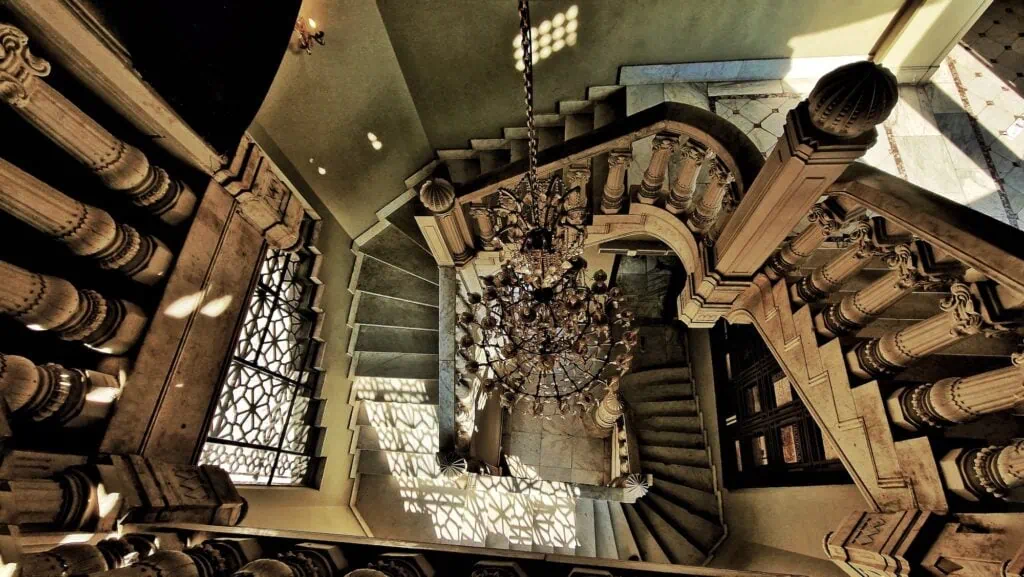The Baron Empain Palace stairways viewed from above, showing the geometric interior design and ornate architectural details in Cairo
