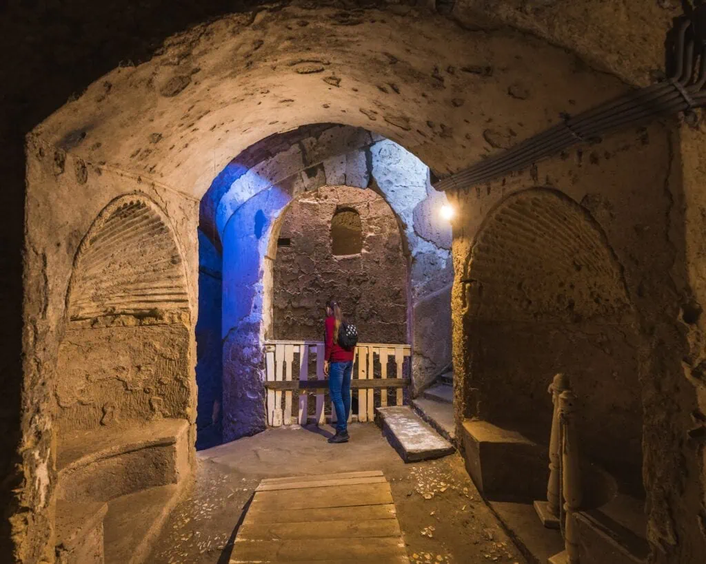 Rock-cut burial chambers and carved stone details inside the Catacombs of Kom El Shoqafa, Alexandria