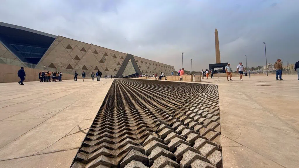 The exterior of the Grand Egyptian Museum near the Giza plateau, with its monumental triangular alabaster facade, Cairo, Egypt.