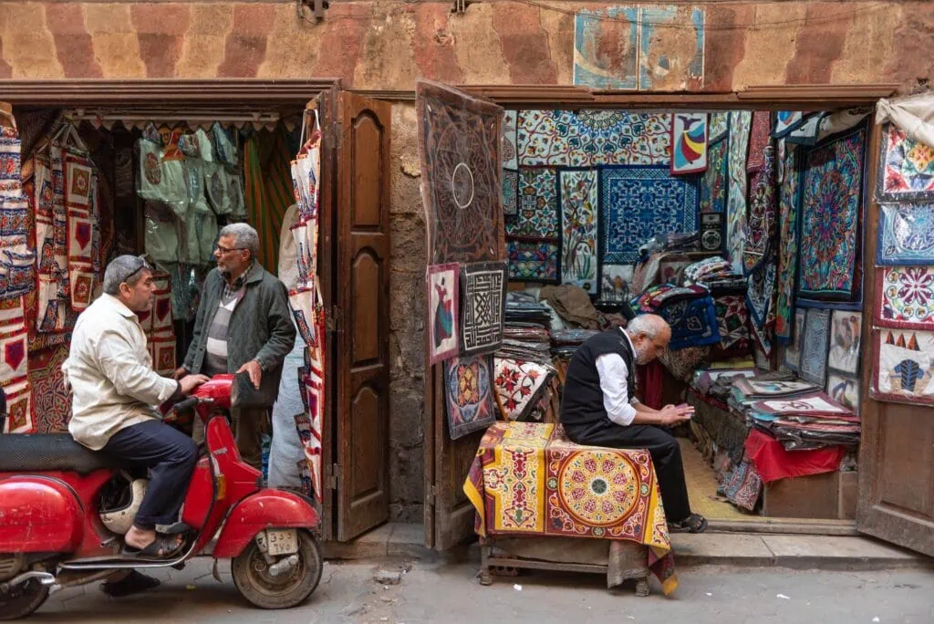 Shops displaying Egyptian textiles and fabrics in the Tentmakers Bazaar near Khan El Khalili in Islamic Cairo Cairo